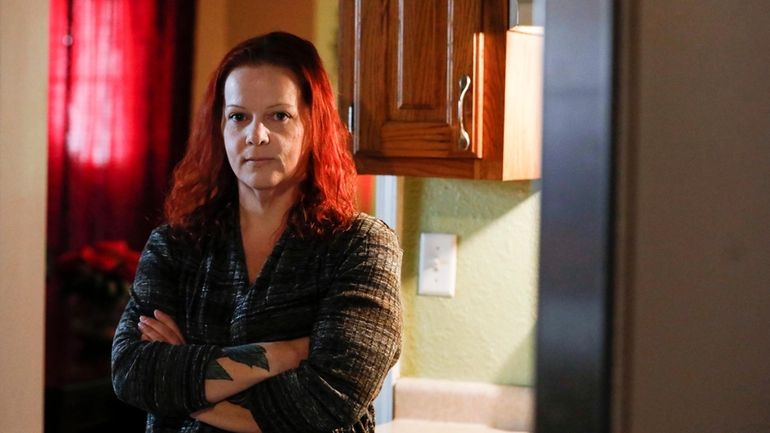 Mylissa Farmer stands for a portrait at her home in...