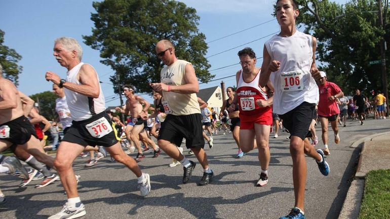 Runners break from the starting line during the 32nd Annual...