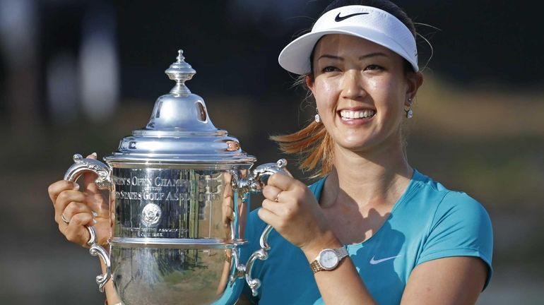 Michelle Wie poses with the trophy after winning the U.S....