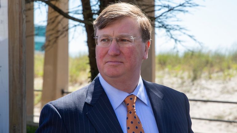 Mississippi Republican Gov. Tate Reeves is at the unveiling of...