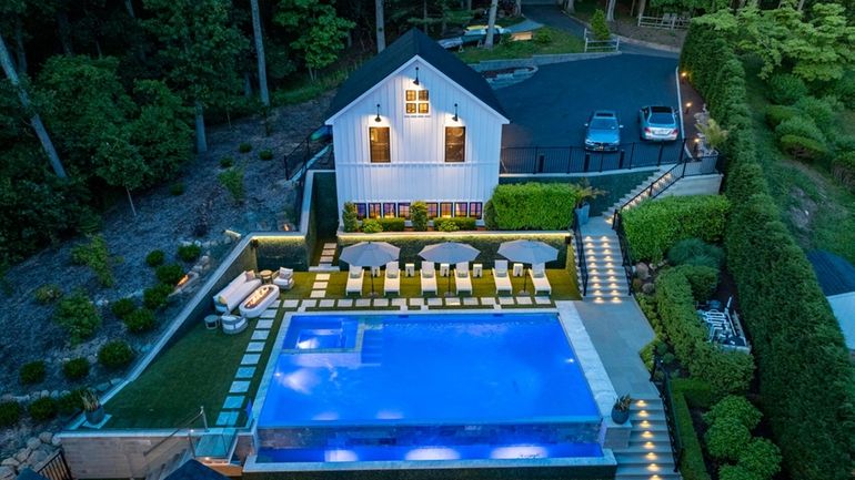 This Centerport home with a built-in spa is listed for...