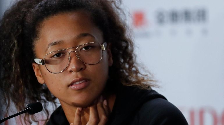 Naomi Osaka speaks during a press conference at the WTA Finals in...