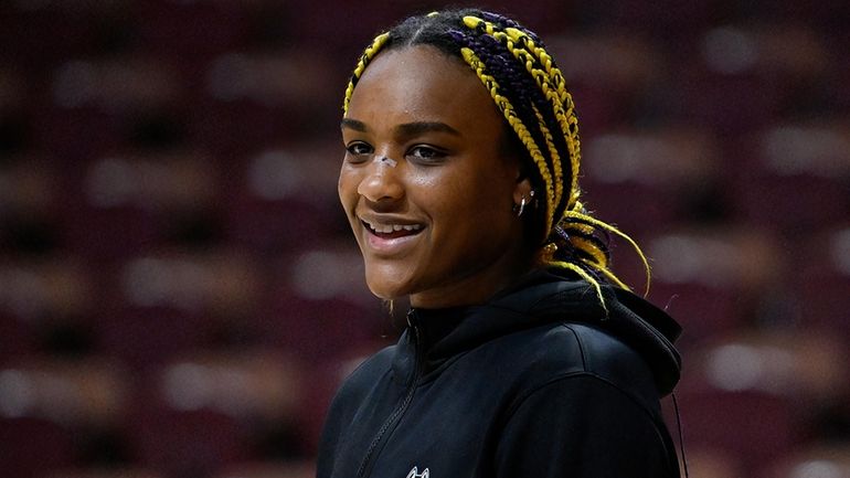 UConn forward Aaliyah Edwards (3) smiles as she watches her...