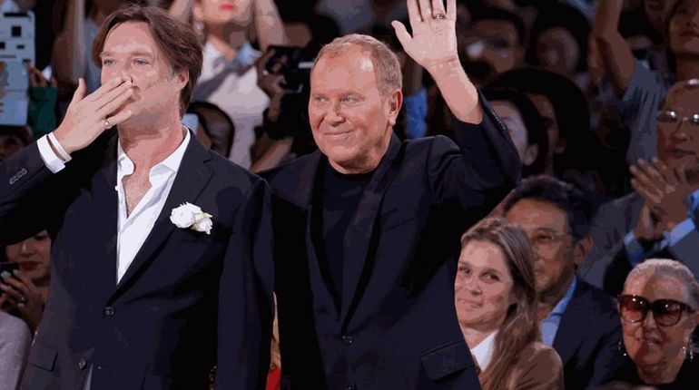 Musician Rufus Wainwright, left, and fashion designer Michael Kors take...