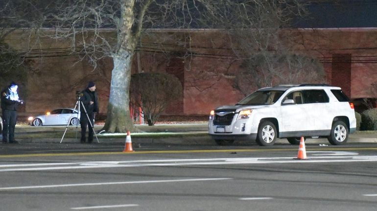 Suffolk County police at the crash scene on Commack Road...