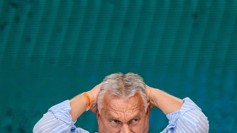 Hungarian Prime Minister Viktor Orban waits to deliver a speech...