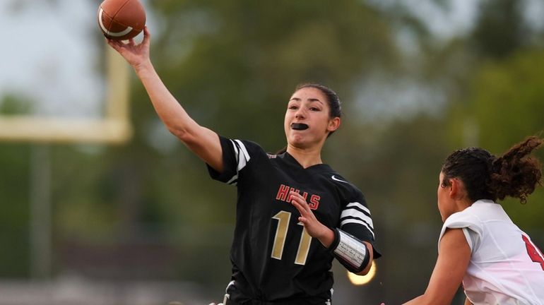 Samantha Heyman #11 from Half Hollow Hills throws a pass...