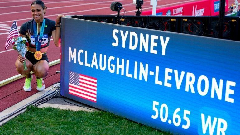 Sydney McLaughlin-Levrone poses for a photo after winning the women's...