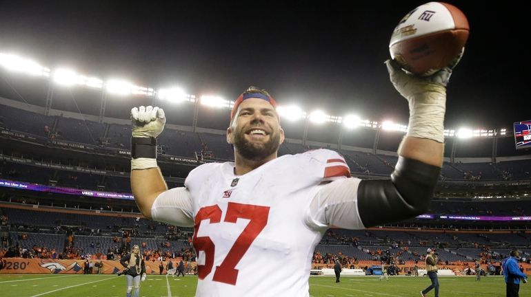 Giants guard Justin Pugh celebrates after defeating the Broncos in...