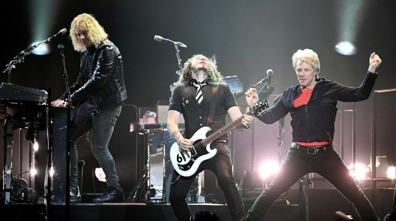 Keyboardist David Bryan, left, guitarist Phil X and frontman Jon...