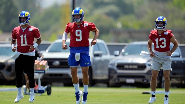 Los Angeles Chargers quarterback Jimmy Garoppolo, left, Matthew Stafford, center,...