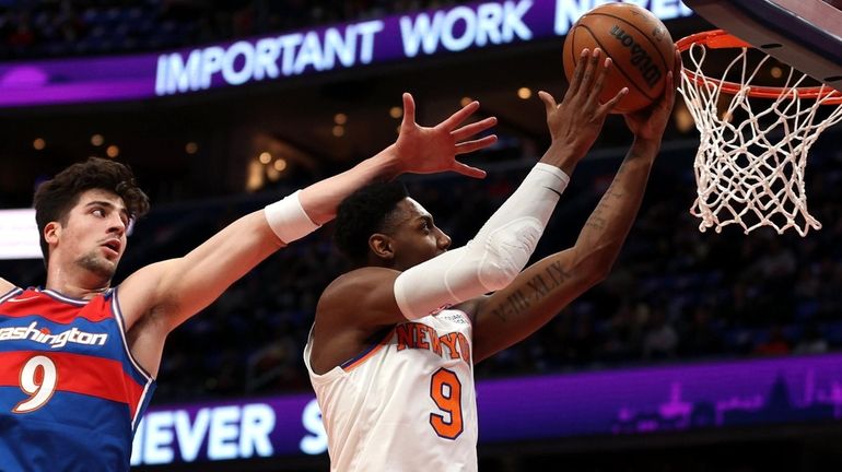 RJ Barrett #9 of the New York Knicks shoots in...