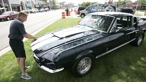 Jarrod Kings closes the hood on his 1967 Ford Shelby...