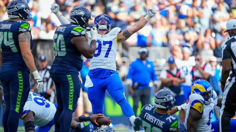 Los Angeles Rams linebacker Michael Hoecht celebrates after sacking Seattle...