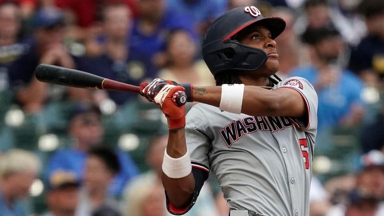 Washington Nationals' CJ Abrams hits a two-run home run during...