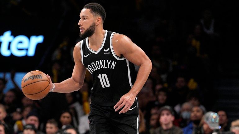 Ben Simmons of the Nets dribbles the ball during a game...