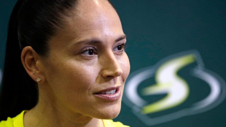 Seattle Storm's Sue Bird talks with media members at the...