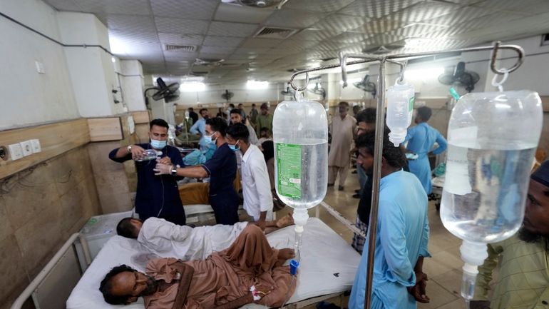 Heatstroke patients receive treatment at a hospital in Karachi, Pakistan,...