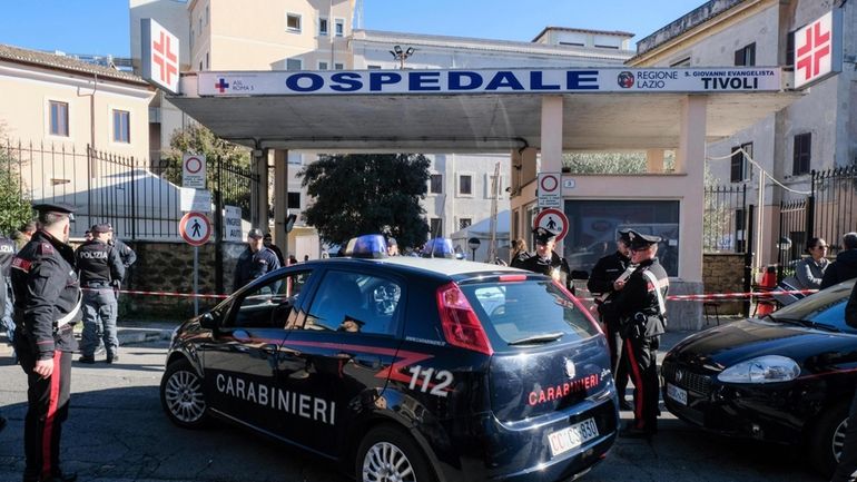 Carabinieri (Italian paramilitary police) officers outside the San Giovanni Evangelista...