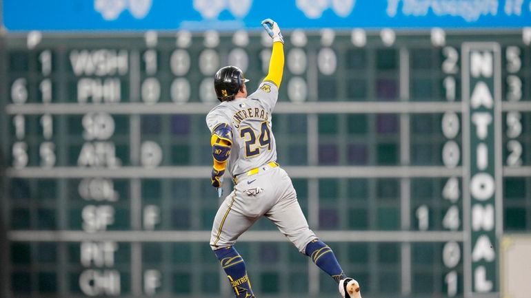 Milwaukee Brewers' William Contreras rounds the bases after hitting a...