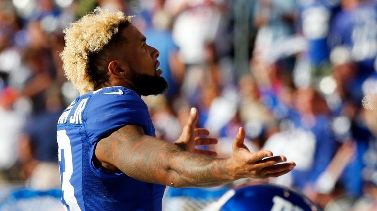 Odell Beckham #13 of the New York Giants reacts during...