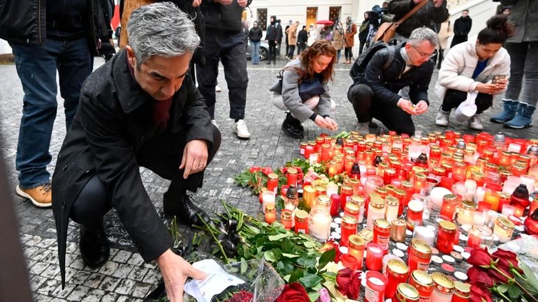 U.S. Ambassador to the Czech Republic Bijan Sabet lays flowers...