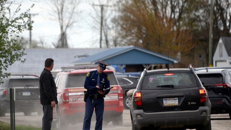 A law enforcement official monitors the perimeter of the Swan...