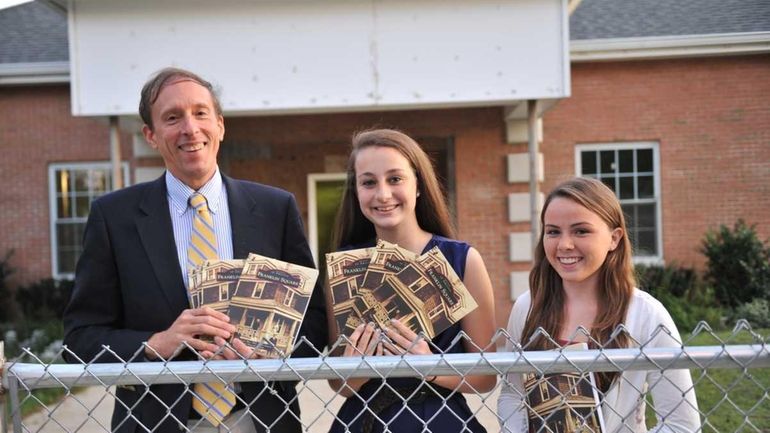 Hannah Mutum, center, and Kiera Grassi co-wrote the book with...