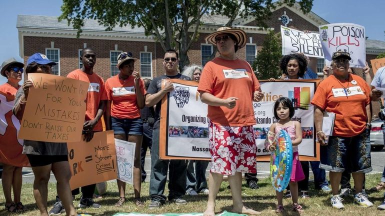 Lucas Sanchez, middle in shorts, stands with his daughter, Ana...