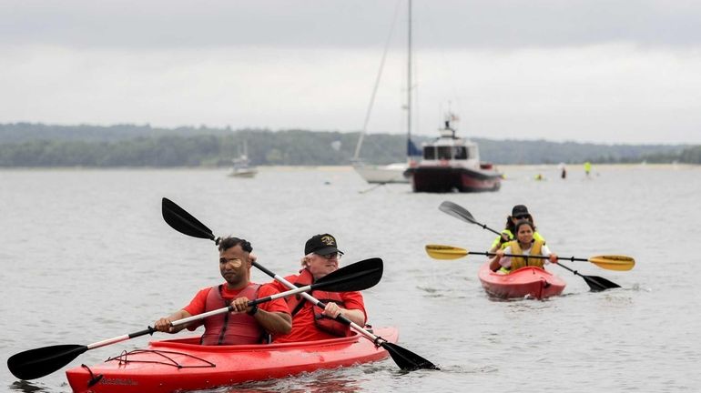 James Van Thach, left, of Queens, an Iraq veteran, and...