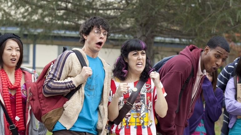 Paul Iacono, center left, and Kara Taitz, center right, in...