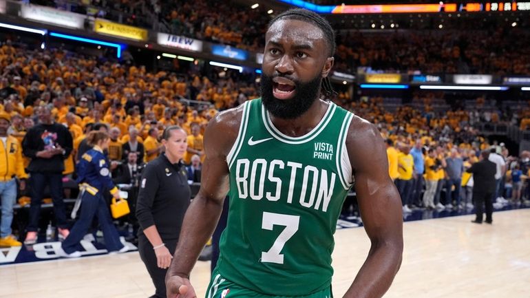 Boston Celtics guard Jaylen Brown (7) celebrates after Game 4...