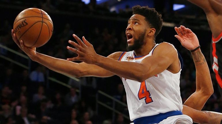 Chasson Randle of the New York Knicks goes to the...