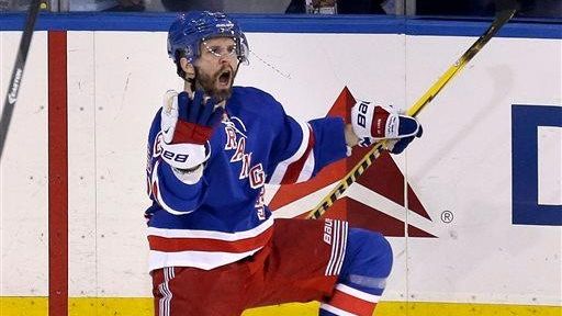 The Rangers' Martin St. Louis celebrates his game-winning goal during...