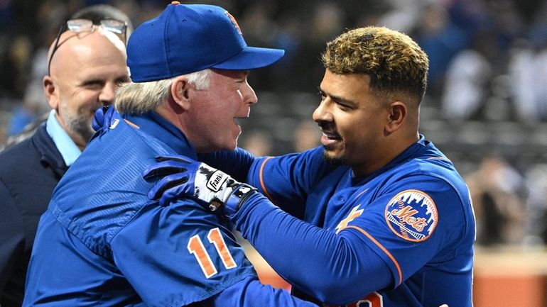 Mets manager Buck Showalter Eduardo Escobar after his walk-off single...