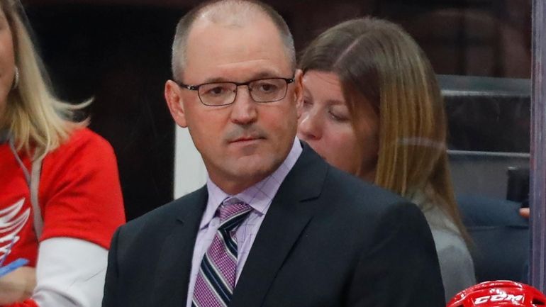 Detroit Red Wings assistant coach Dan Bylsma watches the first...