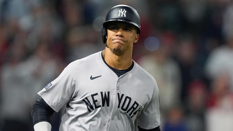 Yankees' Juan Soto reacts after flying out to Los Angeles...