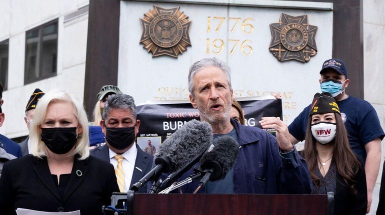 Former host of 'The Daily Show' Jon Stewart (C), beside...