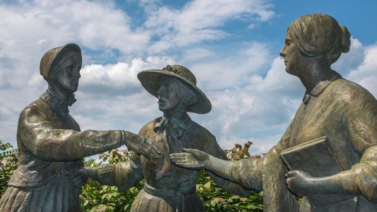 A statue at Seneca Falls depicting the first meeting of...