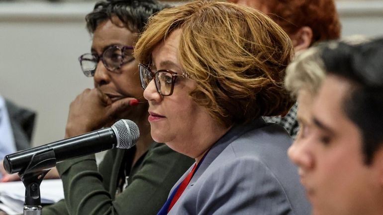 Amityville schools Superintendent Gina Talbert, center, during a meeting of...