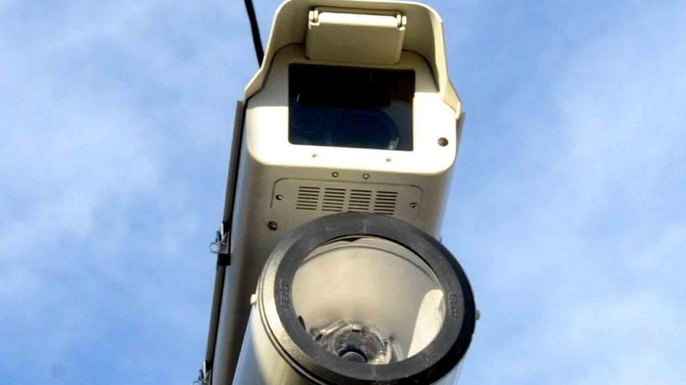 A red-light camera monitors the North Service Road of the...