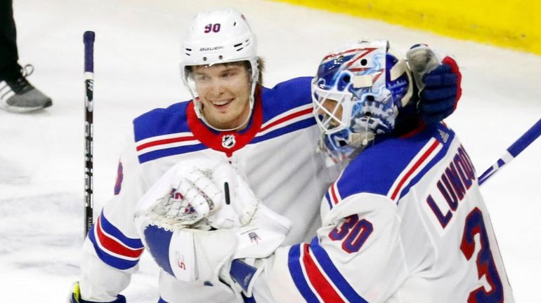 The Rangers' Vladislav Namestnikov congratulates goaltender Henrik Lundqvist after defeating...