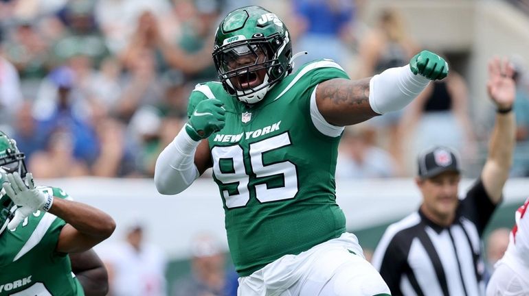 New York Jets defensive tackle Quinnen Williams (95) is introduced as he  takes the field to face the Tennessee Titans during an NFL football game,  Sunday, Oct. 3, 2021, in East Rutherford