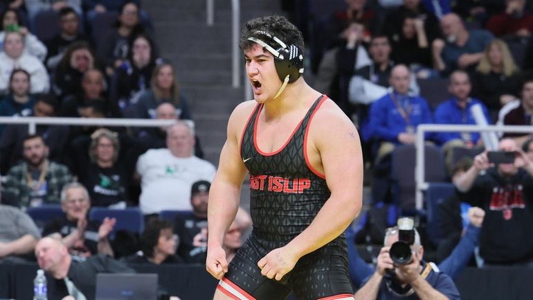 Sebastian Regis of East Islip after pin of Stephan Monchery...