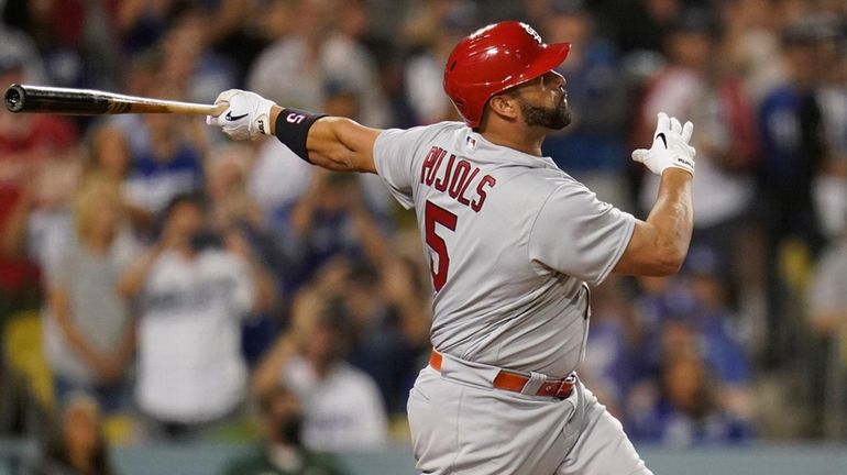 Cardinals designated hitter Albert Pujol hits a home run during the...