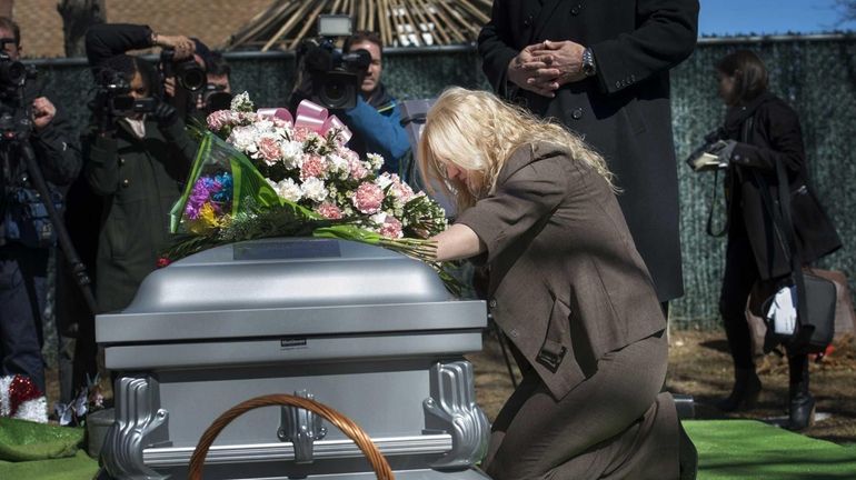 The late Shannan Gilbert's mother, Mari Gilbert, grieves during funeral...