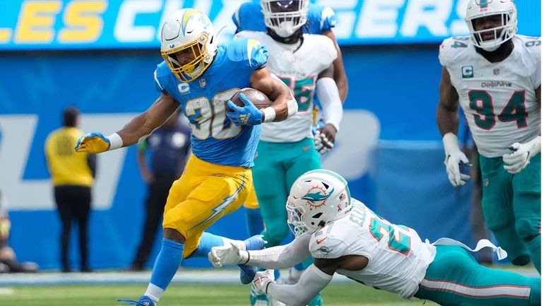 Los Angeles Chargers running back Austin Ekeler (30) runs past...