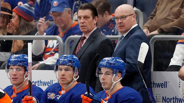 Head coach Lane Lambert (L) and assistant coach John MacLean...