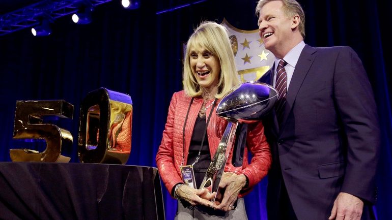 NFL Commissioner Roger Goodell poses with Norma Hunt, the widow...