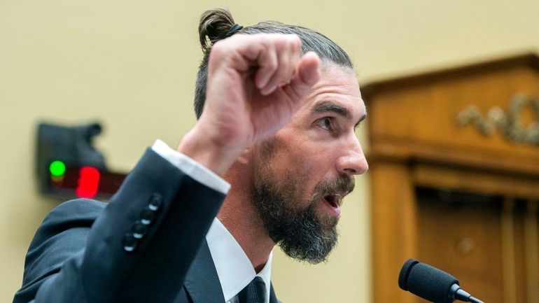 Michael Phelps, former Olympic athlete, testifies during a House Committee...